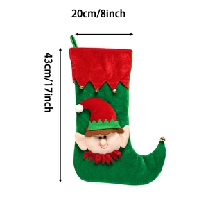 Christmas elf gift stocking with bells and velvet fabric in red and green colors
