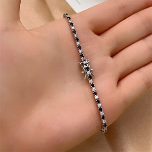 Tennis bracelet with sparkling black and white cubic zirconia and double safety clasp