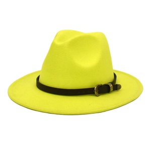Detail of neon yellow wool fedora hat with black leather strap and gold vintage buckle