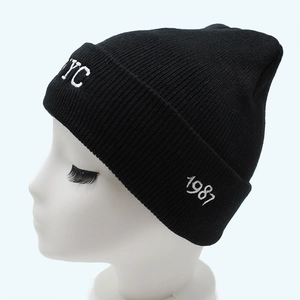 Classic black knitted beanie with white NYC embroidery and 1987 detail on folded cuff