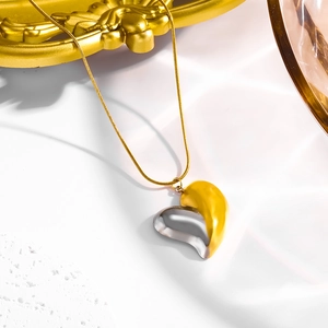 Exaggerated 18K bicolor heart pendant necklace with gold snake chain for women