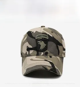 Front detail of tactical camouflage baseball cap featuring an embroidered airborne shield patch