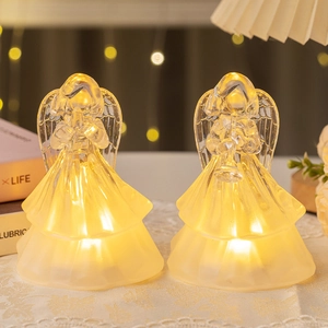 Set of two LED angel night lights in frosted acrylic with warm yellow glow