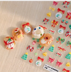 Close-up of TS-3884 3D embossed Christmas nail stickers featuring festive bow motifs