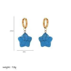 Detail shot of turquoise star charm hoop earrings with 3.9cm length measurements