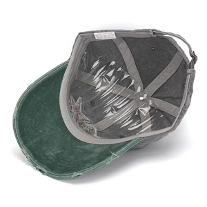 Detail view of washed cotton baseball cap inner lining and 100% cotton fabric label