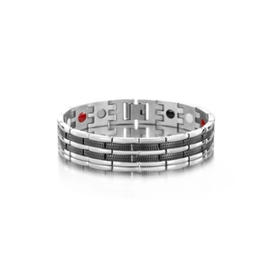 Macro detail of men's titanium magnetic bracelet with textured links and energy stones