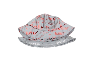 Close-up of reflective metallic BABY graffiti on the grey outdoor bucket hat fabric