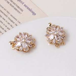 Detailed close-up of a gold-plated flower clasp with micro-set zircons for jewelry making