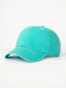 Close-up of mint green washed cotton baseball cap showing twill fabric and air vents