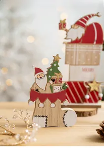 Detail of wooden Merry Christmas table ornaments with Santa and glitter gift box design
