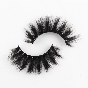 Close-up of voluminous 3D faux mink eyelashes with dense black synthetic fibers on white