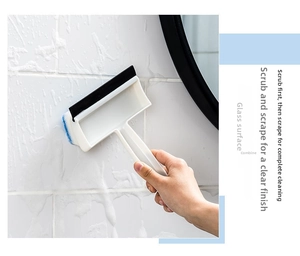 Close-up of a 2-in-1 cleaning brush with rubber squeegee for bathroom tiles and mirrors