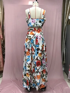 Back view of a floral print two-piece set featuring a cropped camisole and pleated maxi skirt