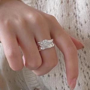 Minimalist S925 sterling silver wide band ring with irregular wave texture on hand