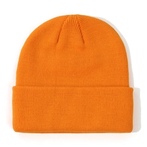 Detailed close-up of vibrant orange ribbed knit beanie with stylish folded cuff