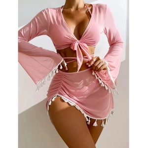Pink bohemian four-piece bikini set with long sleeves, sheer fringe skirt and beach cover-up