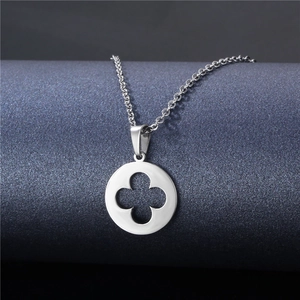 Chic silver stainless steel necklace with hollow clover pendant on dark display