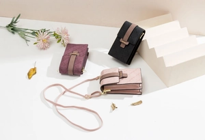 Vertical plaid mini crossbody phone bags in pink, black, and burgundy with long straps