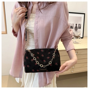 Black corduroy strawberry embroidery cylinder bag with gold floral chain for women