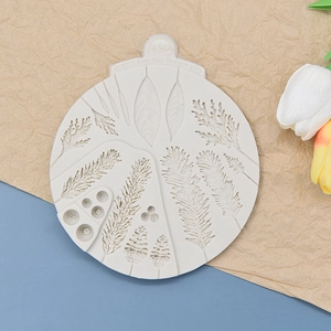 Detailed texture of silicone mold featuring pine needles, cones and berries for baking