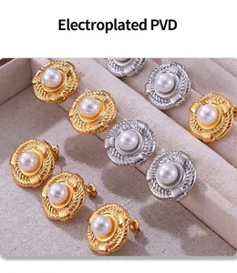 Detail of vintage geometric twist earrings with shell pearls in gold and silver finish