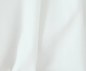 Close-up macro view of white princess dress fabric showing soft texture and fine weaving