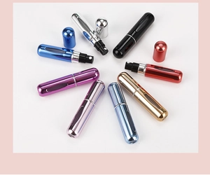 Top-down view of 5ml portable perfume spray bottles in eight metallic colors