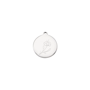 Detailed view of silver stainless steel round pendant with floral engraving and top ring