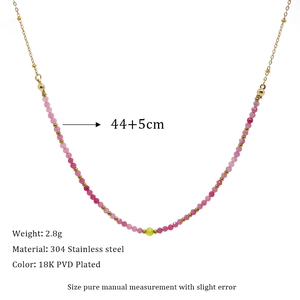 Detail view of colorful beads and 18K gold-plated stainless steel necklace with specs