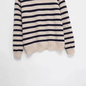Classic crewneck striped knit sweater in beige and navy blue with ribbed texture