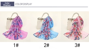 Detailed color display of light chiffon scarves with floral prints on a handbag