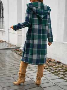 Close-up of green and blue plaid hooded jacket for women with stylish button-up detail