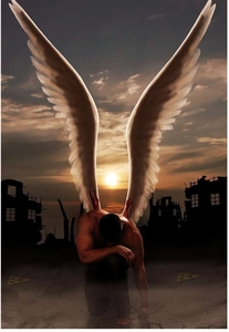 Artistic detail of a male angel with large white wings kneeling in a ruin during sunset