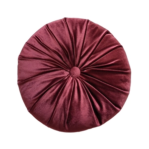 Round burgundy velvet pumpkin cushion with pleated design and central button detail