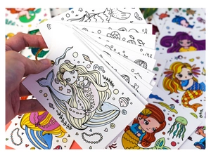 Detail of DIY mermaid coloring cards showing blank outlines and vibrant colored examples