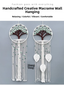 Detail of bohemian woven wall hanging with tree of life design and green leaf tassels