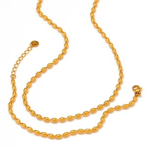 Detailed view of British style stainless steel bean chain necklace in gold finish