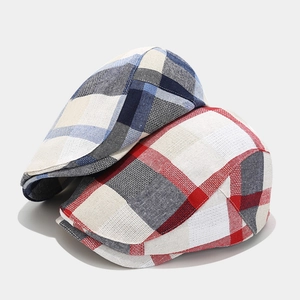 Classic British plaid newsboy caps in red and blue textured weave for autumn style