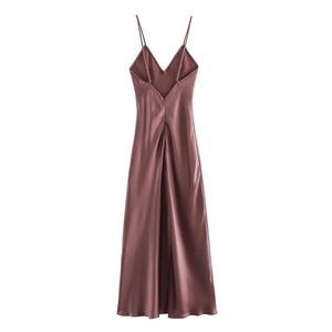 Close-up of coffee brown satin slip dress showing back invisible zipper and silky texture