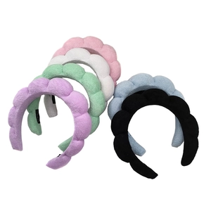 Padded cloud sponge headband in six pastel colors featuring a handmade woven design
