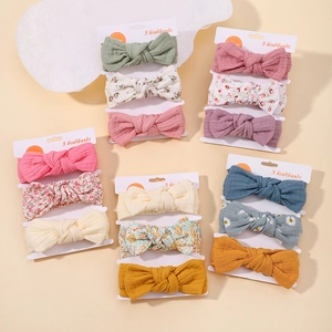 Detailed set of floral cotton baby headbands with bows in various colors and patterns