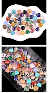 Close-up of assorted heart-shaped natural stone pendants with gold and silver metal edges