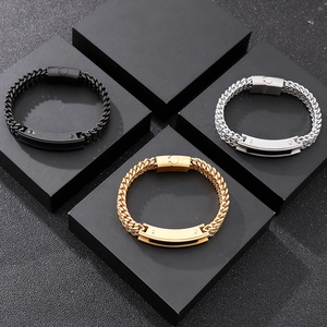 Detailed view of woven metal chains in black, gold, and silver with magnetic clasps