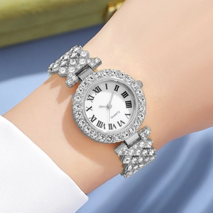 Silver quartz watch for women with roman numerals and rhinestones on a wrist