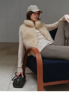 Beige faux fox fur cashmere vest styled with casual outfit and baseball cap