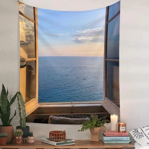 Detail of bohemian tapestry showing a sea view window scene with interior decor items