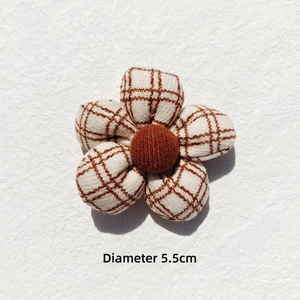Close-up of a 5.5cm beige plaid fabric flower with a brown plush center for DIY crafts