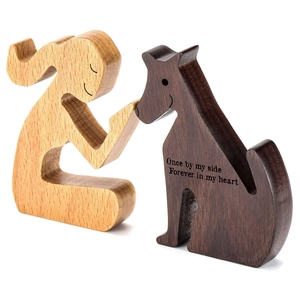 Handcrafted wooden sculpture of a person and dog with forever in my heart engraving