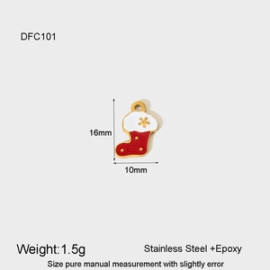 Macro view of Christmas sock pendant in red and white epoxy with 16x10mm dimensions